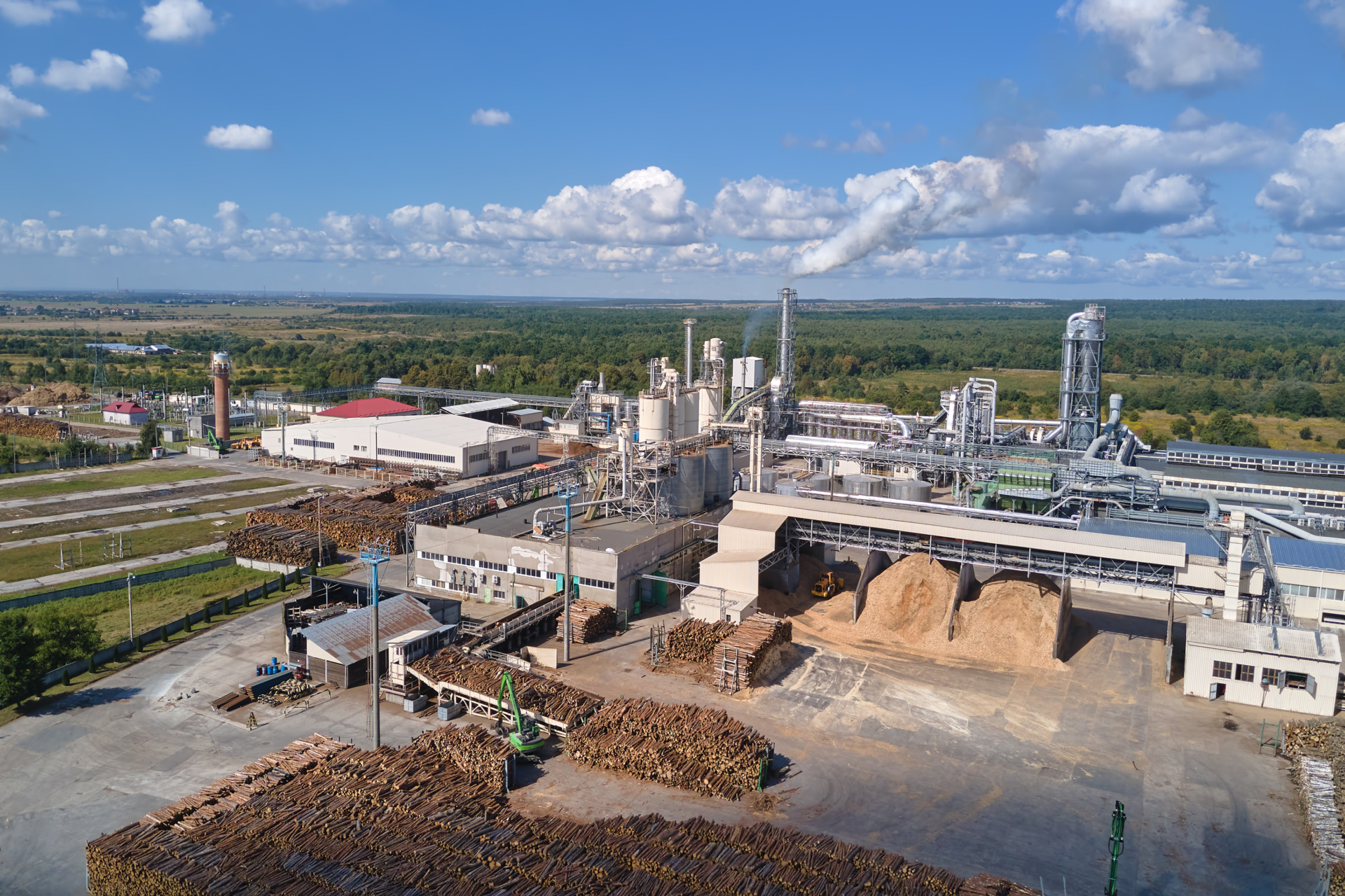 Aerial view of factory with high plant manufacture structure. Global production and manufacturing concept.