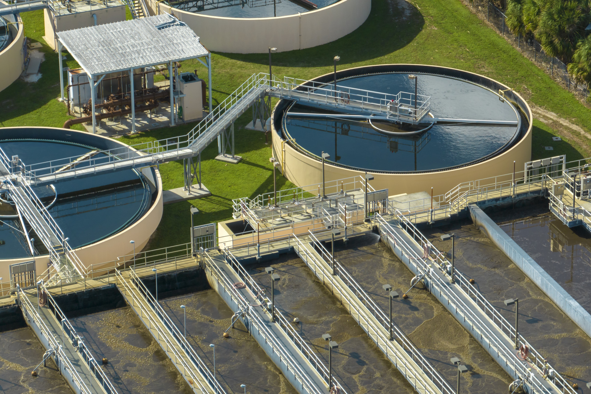 Aerial view of water treatment factory at city wastewater cleaning facility. Purification process of removing undesirable chemicals, suspended solids and gases from contaminated liquid.